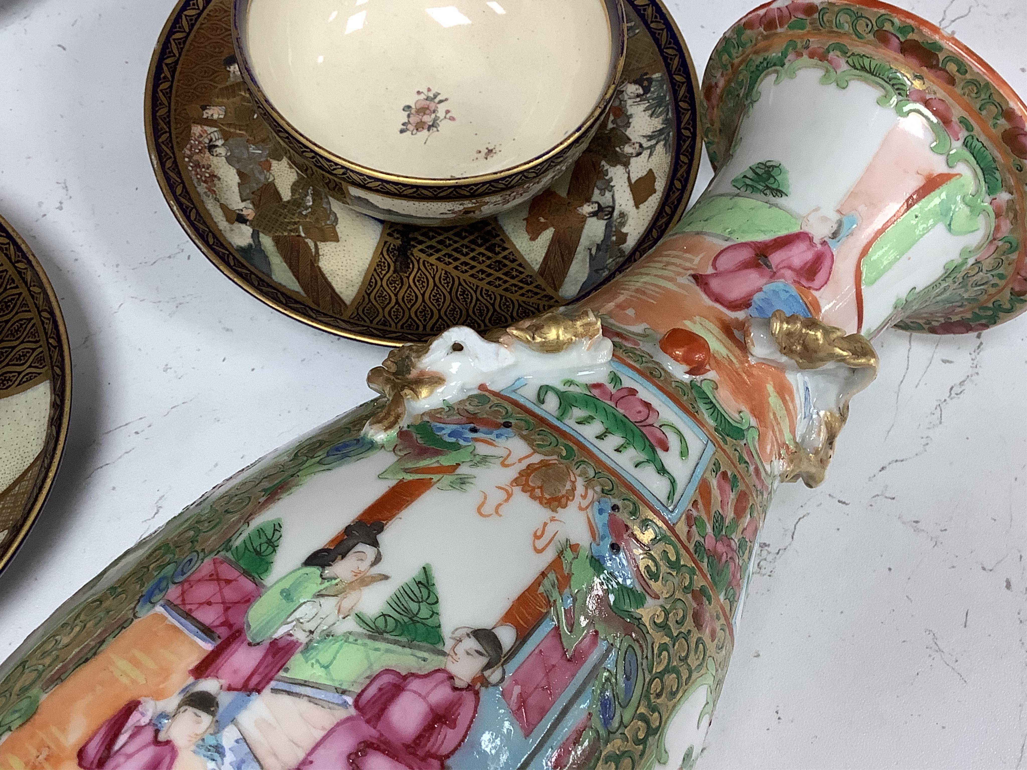A pair of 19th century Chinese famille rose vases, 25cm